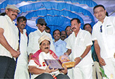 Kannada Chaluvali Leaders Sri Vatal Nagaraj and Sri Sa. Ra. Govindu felicitating Dr. Wooday P. Krishna on 13-7-2015, Bengaluru, under the auspices of Kannada Rakshana Samiti.
