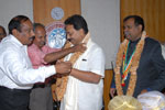 Dr. T. Ananthpadmanabha and Er. A. S. Satish, Council Members, IEI felicitating Dr. Wooday P. Krishna,Chairman, IEI, Karnataka State Centre, in the presence of Er. Ashok Kumar Basa, President, IEI, on 1-2-2014.