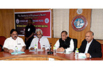 The Institution of Engineers (India) National Council Member Dr. Wooday P. Krishna in an interactive meeting on technology for societal applications with Andhra Pradesh and Telengana Governor Shri E. S. L. Narasimhan, 2015.  IEI President Dr. L. V. Muralikrishna Reddy and IEI Karnataka State Centre Chairman Prof. R. M. Vasagam were present during the occasion.