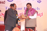 Being felicitated by Dr. C. Somasekher, Deputy Commissioner, Tumkur.